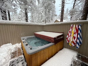 Soak in the private hot tub under snowflakes!