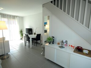 Enjoy the cozy and open-concept living space, perfect for relaxing after a great day.