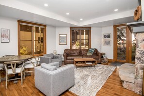 The living room with fireplace, tv, and plenty of seating!