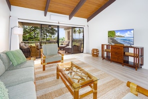 The living room leads straight to the private covered lanai.