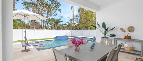 Enjoy your private fully fenced in pool area with a large heated saltwater pool