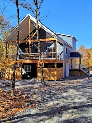 Front shot of Timber Top, property completely wrapped in beautiful mature trees.