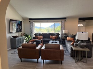 Large picture window in the great room with view of the mesas. 72" streaming TV