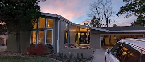 Drive up to a gorgeous, warm mid century modern style home. 