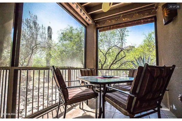 Relax on this sunny screened in patio.