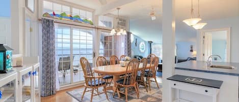 View from entrance door.  Dining/kitchen area out to balcony with beach view.