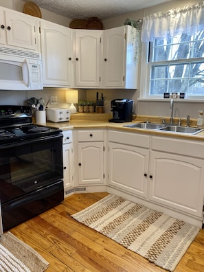 K-cup and coffee pot, toaster, and starter supplies of dishwashing items