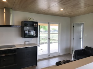 Living space opening out to the deck and north facing decked area.