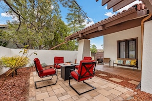 Hang out by the cozy firepit in our club chairs.