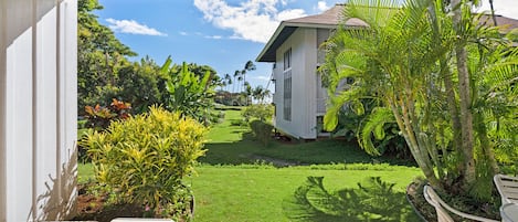 Your private patio with a peekaboo view of the ocean and lawn access