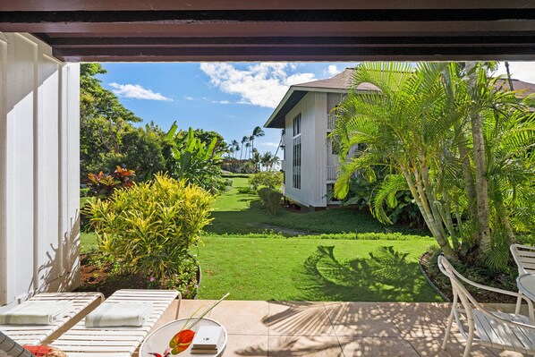 Your private patio with a peekaboo view of the ocean and lawn access