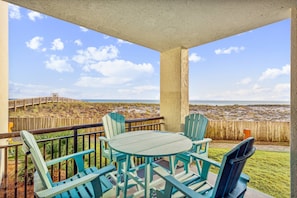 Beachfront patio view steps from white sands of the Gulf of Mexico