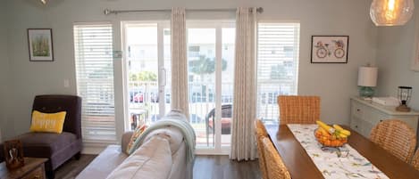 Open concept living and dining area with view of condos