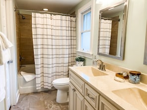 Primary ensuite bathroom with double sinks