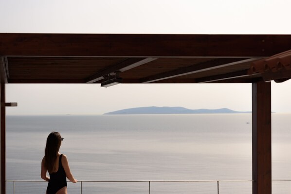 From the balcony you may cherish the Aegean Blue. 