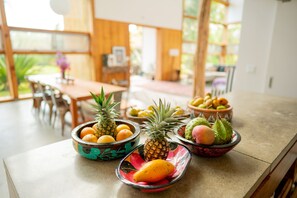 Open floor plan. Kitchen and dining area. Fruits from the land. 