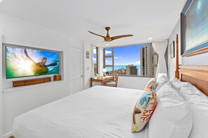 Bedroom with king size bed, TV, ceiling fan and Ocean view