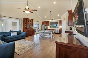 As you enter, view from the front door looking at the living room, dining area , and kitchen.