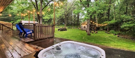 Enjoy the hot tub located off of the main King bed suite deck and also accessed off of the main deck. View the stars at night while enjoying the beautiful landscape lighting at night that spotlights a hand laid stone wall that surrounds the property