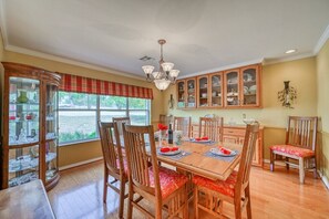 Perfect setting for a family meal with a formal dining room featuring seating for 8.
