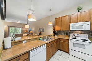 Kitchen stock with dishes, glasses, pans, coffee maker, toaster & blender