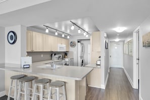 Fully Stocked Kitchen with island bar stool seating; Laundry: Washer & Dryer