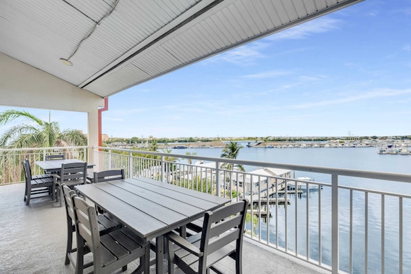 Oversized balcony for hanging out or eating outside with water views, Polywood furniture