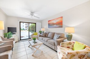 Plenty of space to chill in the living room,  leading out to the patio.