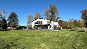 Back of house with view of property