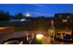 Outside dining with Mount Rainier view.  Tall round table