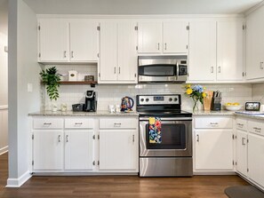 Enjoy a kitchen that's newly and completely remodeled, and fully stocked for all your needs...Keurig coffee machine, fridge, freezer, dishwasher ... everything you need for a home away from home!