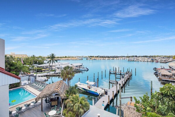View from private balcony of the community pool, tiki bar, dock and Garrison Bight marina