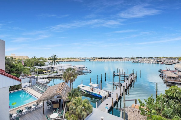 View from private balcony of the community pool, tiki bar, dock and Garrison Bight marina