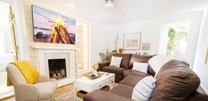 Living Room 75k Roku TV and Faux leather.