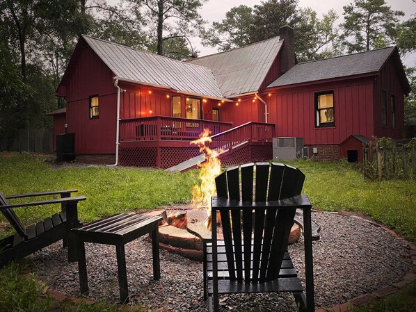 Backyard fire pit overlooking back of home.