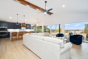 Living room with oversized sectional and lake view