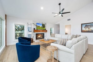 Living room with oversized sectional and lake view