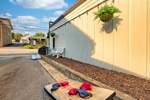Enjoy a game of corn hole during your stay at The Grey Station Bungalow