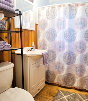 Full bathroom with tub and shower for you to enjoy a nice soak.