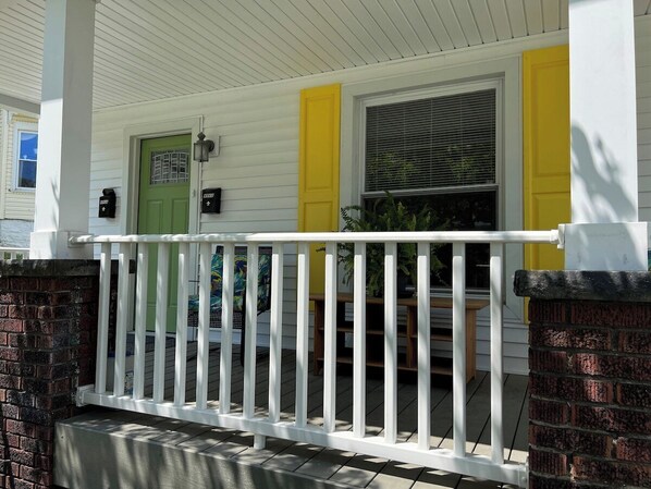 Welcome to The Yellow-Shuttered House! This shows the entrance to the front of the house as it faces the street. The entrance to apartment A is down the alley and in the back of the house.