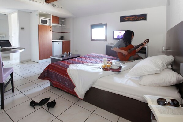 Relax on the comfy bed after a day outside.