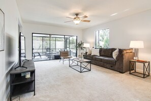 Living area overlooking sunroom!