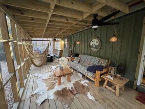 Screened in side porch with access to back deck and master bedroom.  