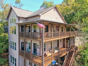 Backside view of both decks and stairs to the dock. 