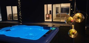 Jacuzzi, living room (with fireplace) and swimming pool (all in the same view).