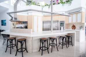 Island seating around the central kitchen.