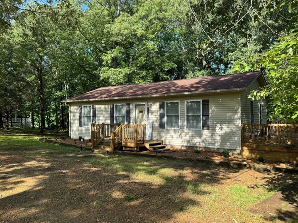 Lovely wooded lot with large circle drive