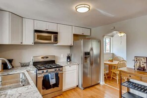 Modern cooking appliances and spacious granite countertops. The kitchen has it all!