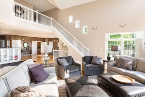 Main floor living room looking upstairs to bedrooms.