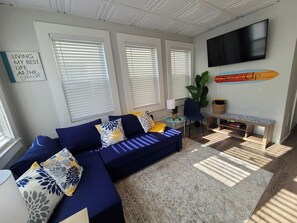 Front Living Room featuring Couch that rolls out into a Double Sleeper